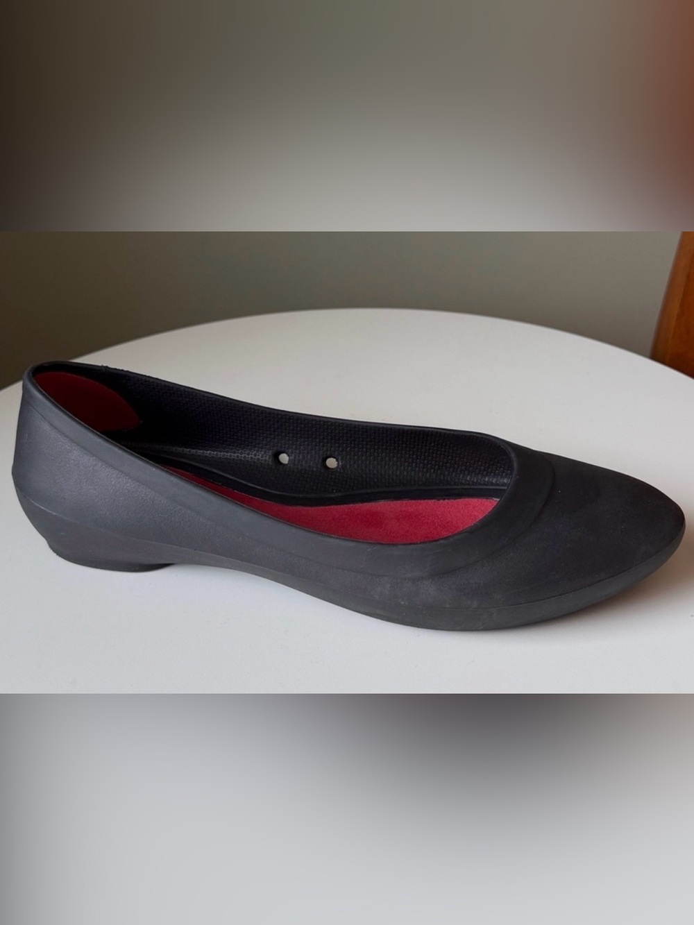 Crocs Lina black comfort ballet slip-on flats with a red insole